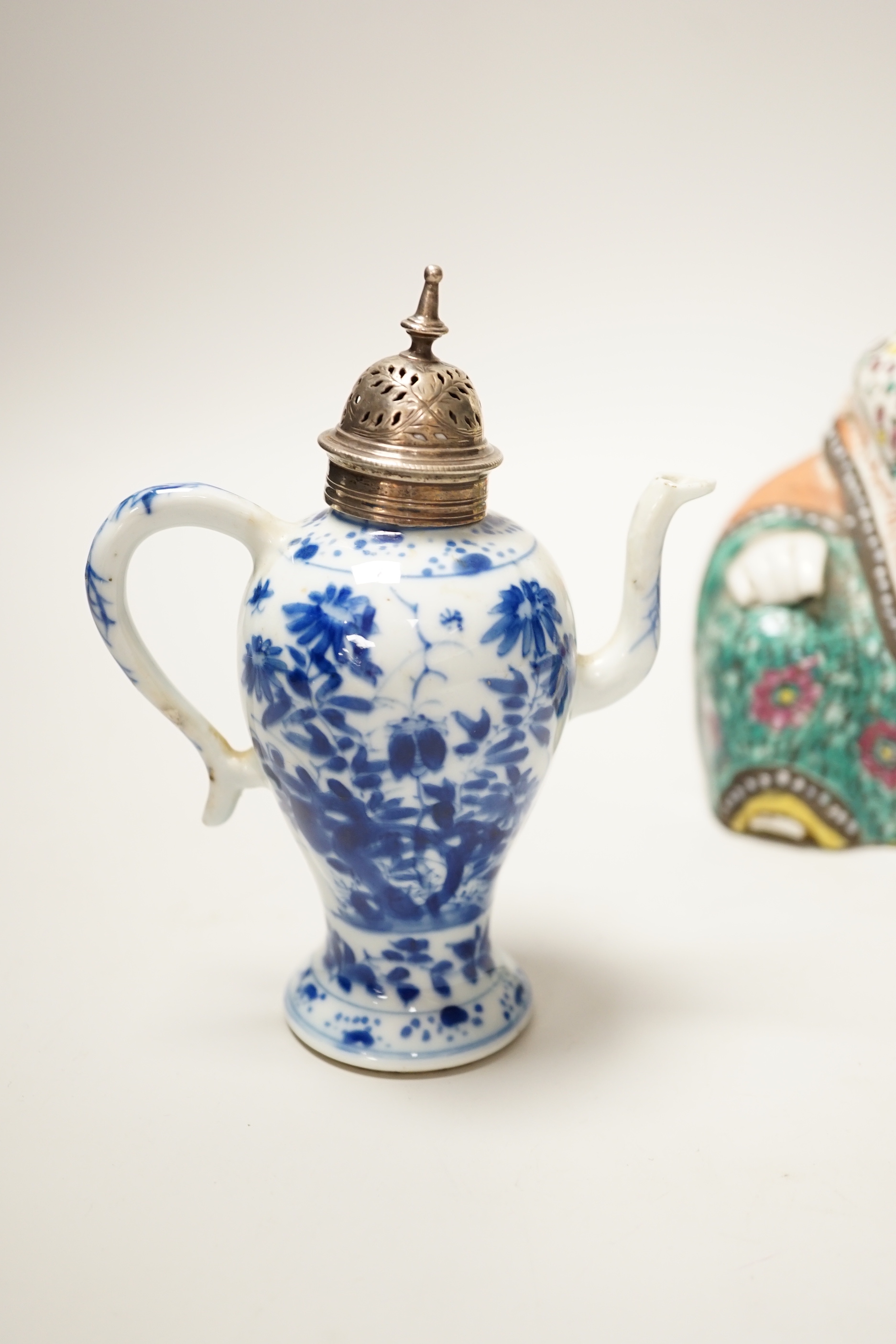 A 19th century Chinese famille enamelled porcelain figure of Budai, 17cm high and a Chinese Kangxi period blue and white small wine ewer and plated cover